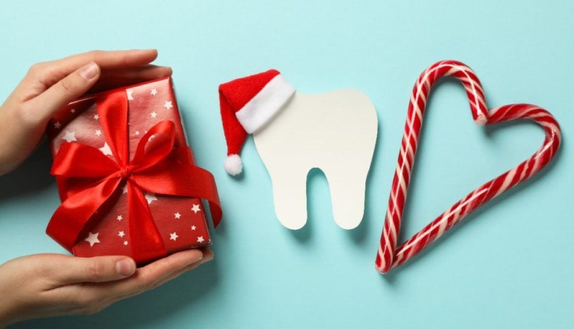 Teeth with Christmas accessories around, flat lay. Teeth with Christmas accessories around, flat lay.